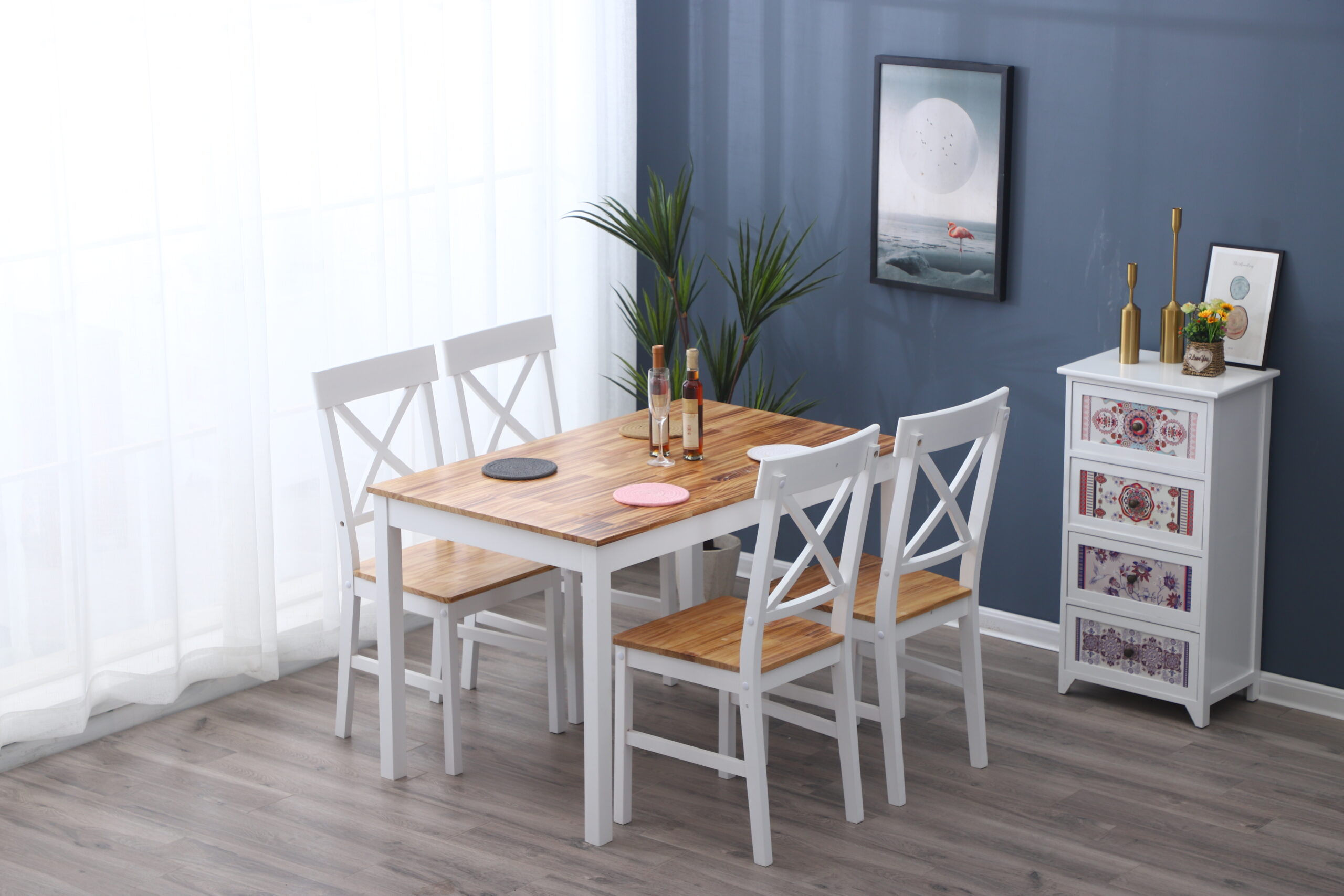 Side tables, coffee tables and dining furniture arranged for product comparison